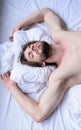 Guy macho lay white bedclothes. Man sleepy unshaven bearded face sleep has rest. Pleasant dream concept. Let your Royalty Free Stock Photo