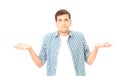 Guy shrugs because he doesn`t know what to do. Isolated on white. Copy space. Mock up. uncertain man