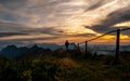 guy silhouette watching at panorama view from a the top of mountain to lake during sunset, brienzer rothorn switzerland