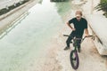 Guy sitting on a bmx bike in the city Royalty Free Stock Photo