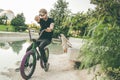 Guy sitting on a bmx bike in the city Royalty Free Stock Photo