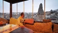 The guy is sitting in a cafe in the city of Goreme. Cappadocia. Turkey.