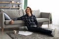 Guy Sitting With Laptop On Floor Working Online At Home Royalty Free Stock Photo