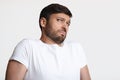 Guy Smelling Unpleasant Stink Frowning Expressing Disgust Over White Background
