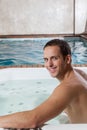 Guy smiling inside a jacuzzi Royalty Free Stock Photo