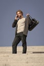 Bearded man with phone and fashionable sport bag Royalty Free Stock Photo