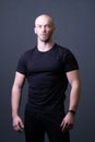 A guy standing in a black T-shirt is a beautiful sexy athlete handsome black man concept blank, In the afternoon male