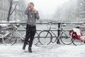 Guy is standing on a bridge