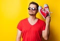 Guy with sunglasses and red gumshoes