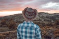 Guy at a sunset in a hat Royalty Free Stock Photo