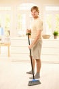 Guy sweeping the floor Royalty Free Stock Photo