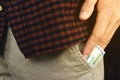 The guy takes out money from the pocket of his pants in a close-up Royalty Free Stock Photo