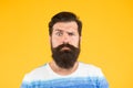 Guy thinking. On his mind. Another idea. Have some doubts. Hipster bearded face not sure. Doubtful bearded man on yellow