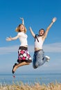 Guy in tie and slim girl jumping