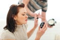 Guy trying to hurry up girlfriend applying make-up