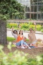 Guy and two girls gesturing affably with hands Royalty Free Stock Photo