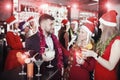 Guy with two girls on new year party in bar