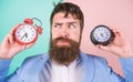 Guy unshaven puzzled face having problems with changing time. Changing time zones affect health. Time zone. Does