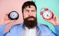 Guy unshaven puzzled face having problems with changing time. Changing time zones affect health. Time zone. Does