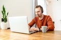 The guy uses hands-free headsets to work from home Royalty Free Stock Photo