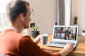 A guy is using laptop for video call, zoom