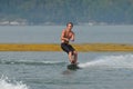 Guy Wakeboarding Behind a Boat in Maine`s Casco Bay Royalty Free Stock Photo