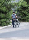 A guy is walking with a Bicycle on the road.02.07.2020 Tashkent,Uzbekistan Royalty Free Stock Photo