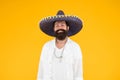 Guy wear poncho. sombrero party man. man in mexican sombrero hat. vacation concept at resort in mexico. hipster with Royalty Free Stock Photo