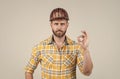 guy wear worker uniform. handsome builder in helmet. mature man wear checkered shirt