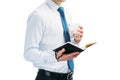 A guy in a white shirt and blue tie on a white background. A man holds a glass with a cocktail and in his second hand is notepad. Royalty Free Stock Photo