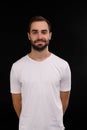 The guy in the white T-shirt on a black background Royalty Free Stock Photo