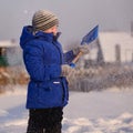 Child in winter clothes outside the city on the background of a Royalty Free Stock Photo