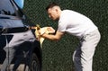 guy wipes his car Royalty Free Stock Photo
