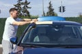 guy wipes his car Royalty Free Stock Photo