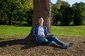 Guy working on laptop in the park Royalty Free Stock Photo