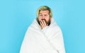 Guy wrapped in blanket the bathroom. handsome man wear the morning. bearded man in white terry bathrobe sleeping at Royalty Free Stock Photo