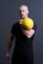 Guy with a yellow kettlebell gym anonymous yellow male, for fit effort from picking for up youth, vietnamese activity Royalty Free Stock Photo