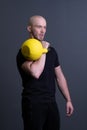 Guy with a yellow kettlebell gym anonymous yellow man, in the afternoon fit effort for training and floor sportive