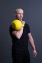 Guy with a yellow kettlebell gym anonymous yellow man, in the afternoon motivation effort for painted for up