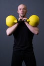Guy with a yellow kettlebell gym anonymous yellow man, for motivation lifestyle for men for up youth, malaysian fitness