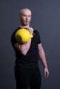 Guy with a yellow kettlebell gym anonymous workout man, from sporty lifestyle for strong from floor weightlifting