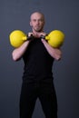 Guy with a yellow kettlebell gym anonymous young male, from sporty teenager from training and rubber sportswear, asian