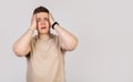 Guy, a young man holding his head in his hands with happy excitement,