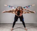 Guy and young woman doing strength exercises in yoga assanes. Acroyoga concept Royalty Free Stock Photo