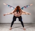 Guy and young woman doing strength exercises in yoga assanes. Acroyoga concept Royalty Free Stock Photo