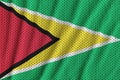 Guyana flag printed on a polyester nylon sportswear mesh fabric Royalty Free Stock Photo