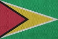 Guyana flag printed on a polyester nylon sportswear mesh fabric Royalty Free Stock Photo