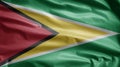 Guyanese flag waving in the wind. Close up of Guyana banner blowing soft silk Royalty Free Stock Photo