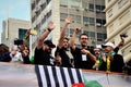 Guys from the channel the Hypocrites interacting with the people from the stand at the demonstration on Paulista avenue