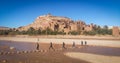 Guys crossing the river in Kasbah Ait Ben Haddou in Morocco. A lot of movies was made there Royalty Free Stock Photo